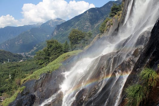 Smashing waterfall with rainbow in Italy