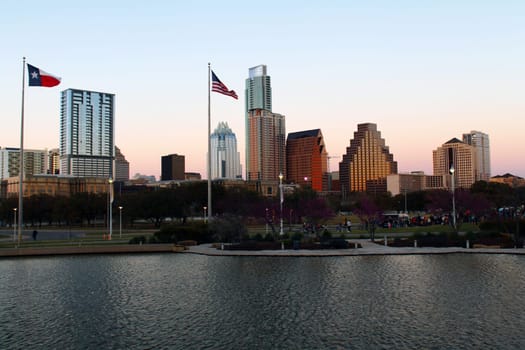 Austin buildings, flags and river in Texas