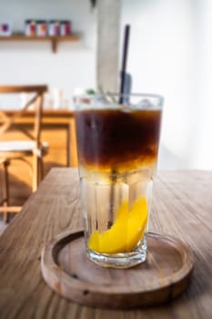 Signature drink of iced peach black coffee, stock photo