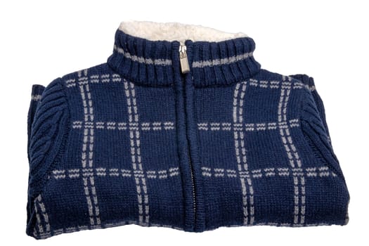 Autumn and winter children clothes. A folded cozy warm dark blue cardigan or jacket with a white checkered pattern for the little boy isolated on a white background. Kids spring fashion.