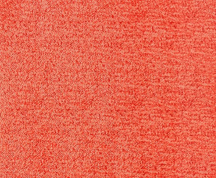 Red glitter foil textured background closeup