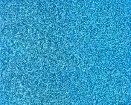 Blue glitter foil textured background closeup