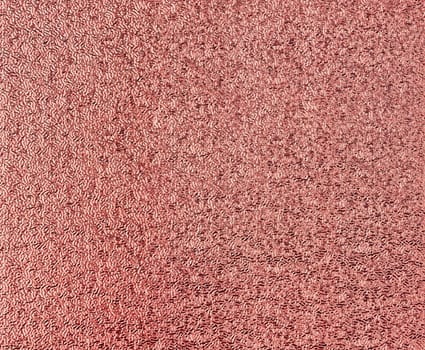 Chocolate color glitter foil textured background closeup