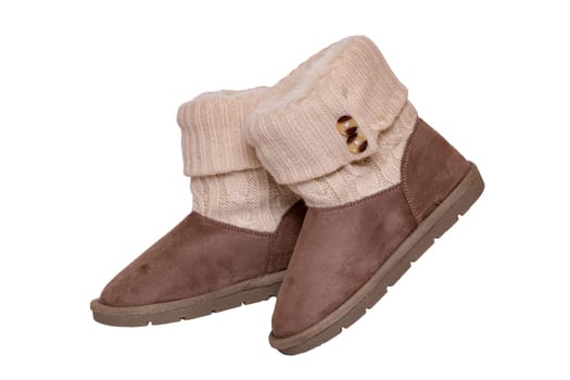 Winter boots. Close-up of a pair elegant brown suede leather winter boots with wool and lined with fur. Girls winter shoe fashion new collection. Isolated on a white background. Macro.