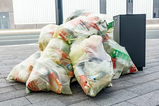 WETZLAR, FGERMANY- 05th of SEPTEMBER 2019 - Many transparent bags with garbage and wastes piled up in a heap