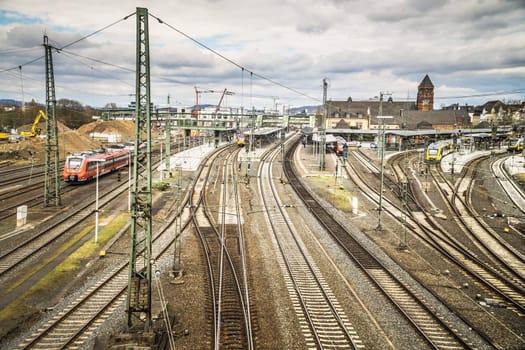 GIESSEN, GERMANY - APRIL 05, 2018: View of the railway station with a lot of Tracks and Train.