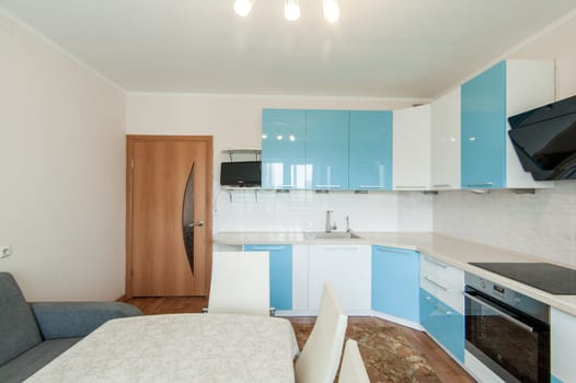 Russia, Moscow- June 05, 2019: interior room apartment. standard repair decoration in hostel. kitchen and dining room