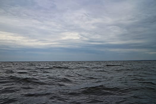 dramatic north sea, black water, empty horizon low clouds