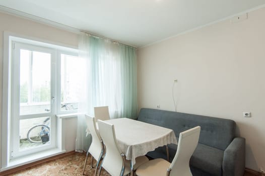 Russia, Moscow- June 05, 2019: interior room apartment. standard repair decoration in hostel. kitchen and dining room