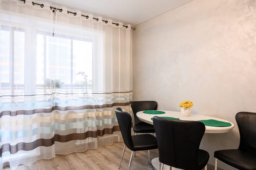Russia, Moscow- June 10, 2019: interior room apartment. standard repair decoration in hostel. kitchen and dining room