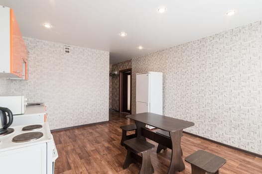 Russia, Moscow- June 10, 2019: interior room apartment. standard repair decoration in hostel. kitchen and dining room