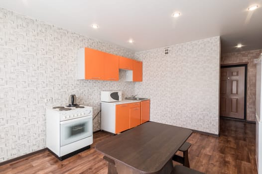Russia, Moscow- June 10, 2019: interior room apartment. standard repair decoration in hostel. kitchen and dining room