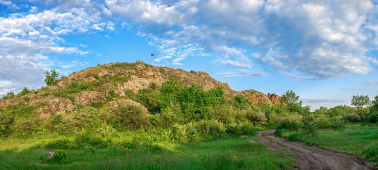 The rocky banks of the Southern Bug River near the village of Migiya in Ukraine on a sunny summer day