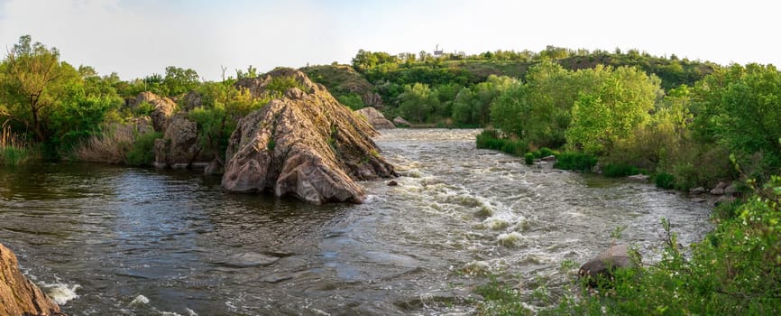 The rocky banks of the Southern Bug River near the village of Migiya in Ukraine on a sunny summer day