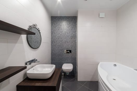 Russia, Moscow- June 11, 2019: interior room apartment. modern bathroom, sink, decoration elements, toilet