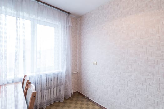 Russia, Moscow- June 11, 2019: interior room apartment. standard repair decoration in hostel. modern kitchen, dining area