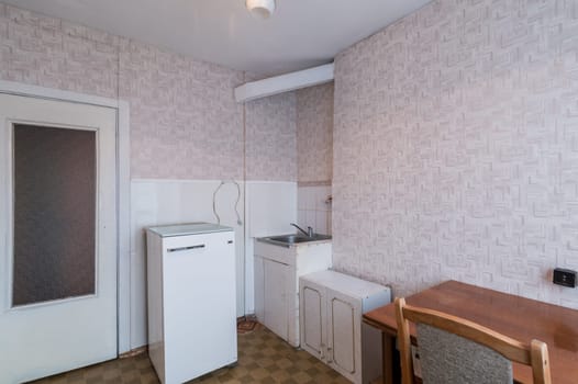 Russia, Moscow- June 11, 2019: interior room apartment. standard repair decoration in hostel. modern kitchen, dining area