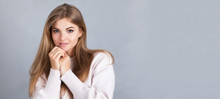 Banner of an attractive blonde, isolated on grey