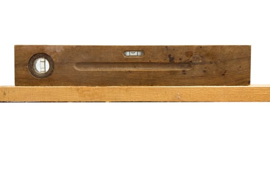 Old vintage wood ruler level meter on the white background