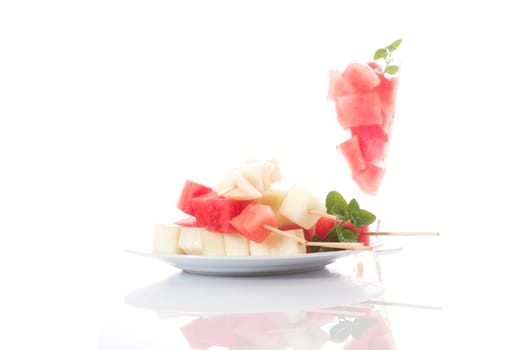 diced melon, watermelon on bright background
