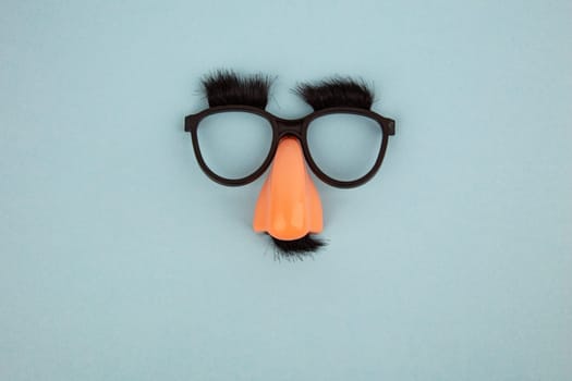 Funny Mask with Eyes and Nose on light blue Background