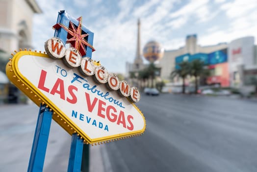 Las Vegas Sign with abstract blurred background of Las Vegas strip boulevard in Las Vegas city Nevada USA