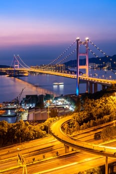 Sunset and light illumination of Tsing ma bridge landmark suspension bridge in Tsing yi area of Hong Kong China.