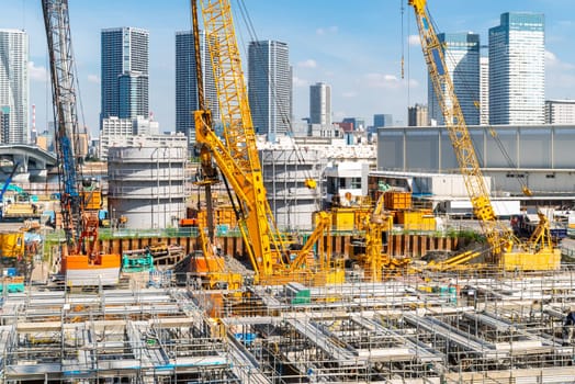 Big construction crane working in big construction site in Tokyo Japan