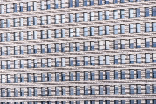 Urban abstract - window facade of business center office building with reflections and colours. Chicago IL USA.