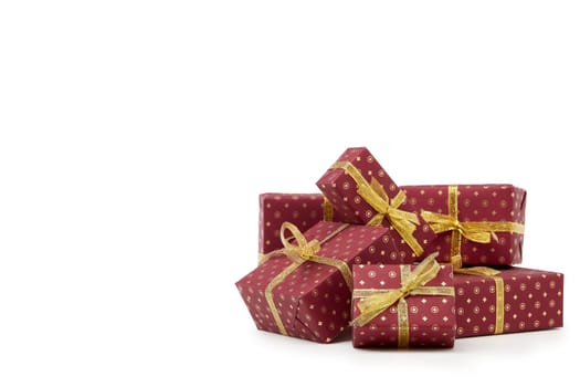 Red gift boxes with golden ribbon isolated on white background with copy space. Christmas, New Year, Shopping.