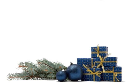Gift boxes and Christmas decoration with fir tree branch isolated on white background with copy space. Christmas and New Year shopping. Greeting card