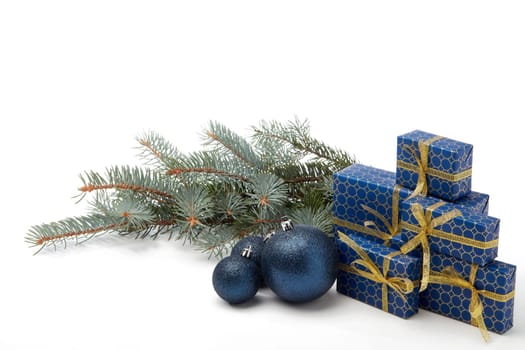 Gift boxes and Christmas decoration with fir tree branch isolated on white background with copy space. Christmas and New Year shopping. Greeting card