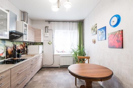 Russia, Moscow- June 11, 2019: interior room apartment. standard repair decoration in hostel. kitchen and dining room