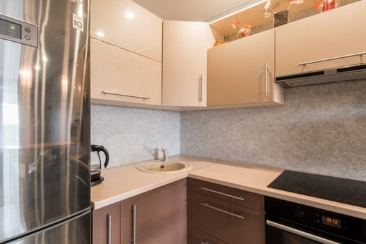 Russia, Moscow- June 11, 2019: interior room apartment. standard repair decoration in hostel. kitchen and dining room