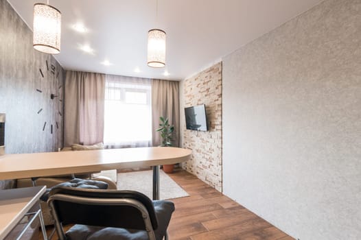 Russia, Moscow- June 11, 2019: interior room apartment. standard repair decoration in hostel. kitchen and dining room