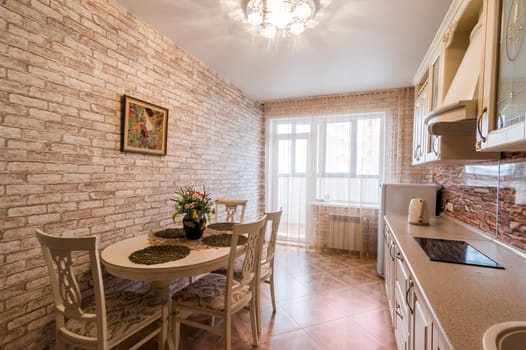 Russia, Moscow- June 11, 2019: interior room apartment. standard repair decoration in hostel. kitchen and dining room