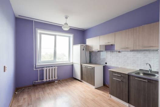 Russia, Moscow- June 11, 2019: interior room apartment. standard repair decoration in hostel. kitchen and dining room