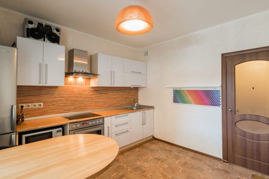 Russia, Moscow- June 11, 2019: interior room apartment. standard repair decoration in hostel. kitchen and dining room