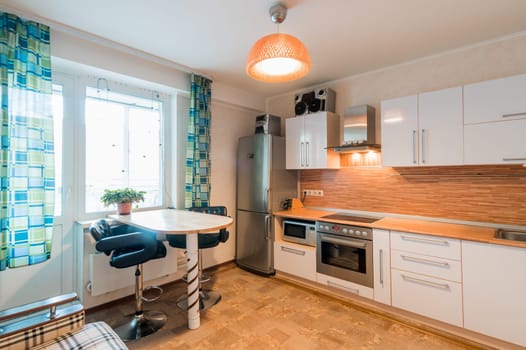 Russia, Moscow- June 11, 2019: interior room apartment. standard repair decoration in hostel. kitchen and dining room
