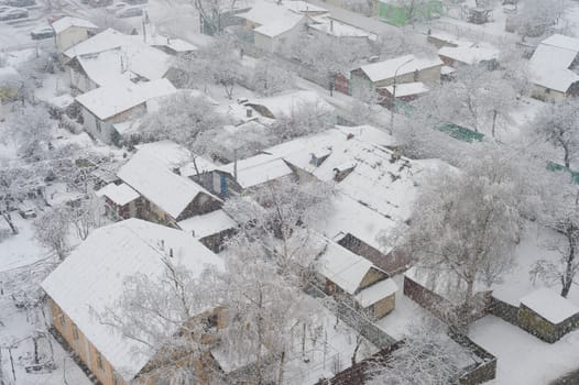 Aerail view of residential area and privat buildings in snowfall winter day, Kiev, Ukraine