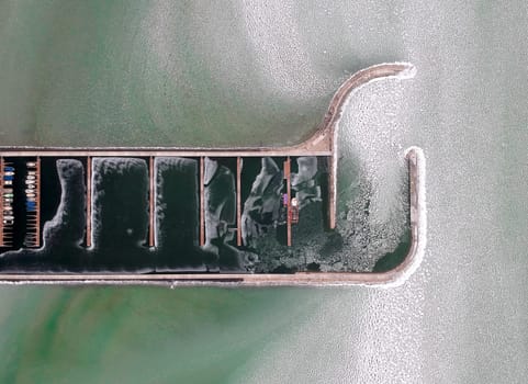 Boats frozen in the water on lake Balaton