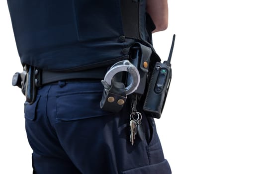 Dutch Policeman on crime scene at school. Red plastic tape police officer, gun belt, handcuffs and gun