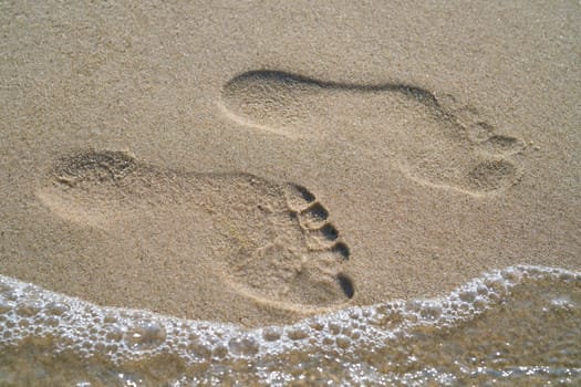 Footprint on the beach of the Baltic Sea at Rewal in Poland
