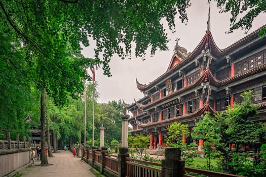 Chengdu, China -  July 2019 : Courtyard and walking path in front of an impressive temple in Wenshu Monastery