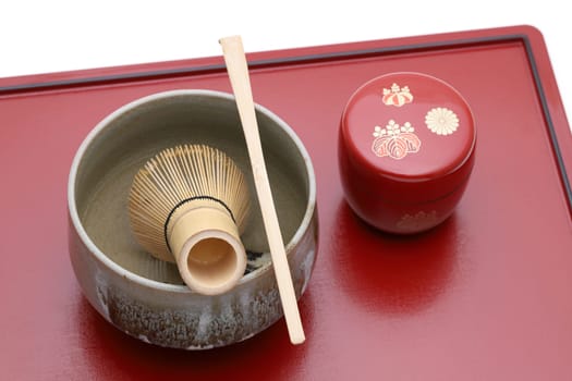 Tea bowl with tea whisk and bamboo spoon used in Japanese matcha green tea ceremony