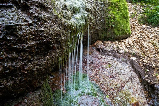 Spring water on a hiking trail through the Landgrafenschlucht at Eisenach in Thuringia
