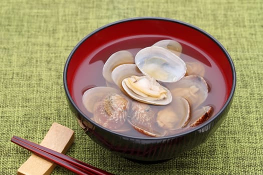 Japanese soy sauce soup with asari clams in a bowl on table