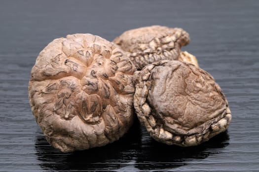 Japanese dried shiitake mushrooms on black background