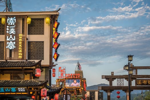 Wulingyuan, China - August 2019 : Neons, lanterns and facades of hotels, shops and restaurants in touristic part of town