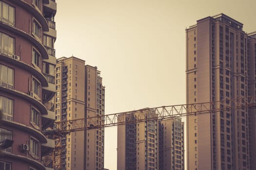 Chengdu, China -  July 2019 : Cranes on the building site of brand new high rise living apartments in the centre of Chengdu, Sichuan Province